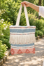 Red and green tote bag in a garden